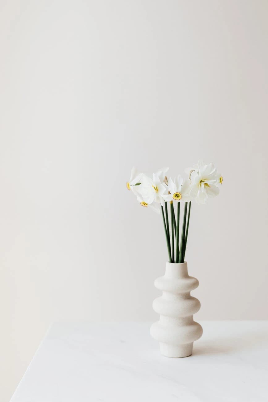 White ceramic vase with flowers